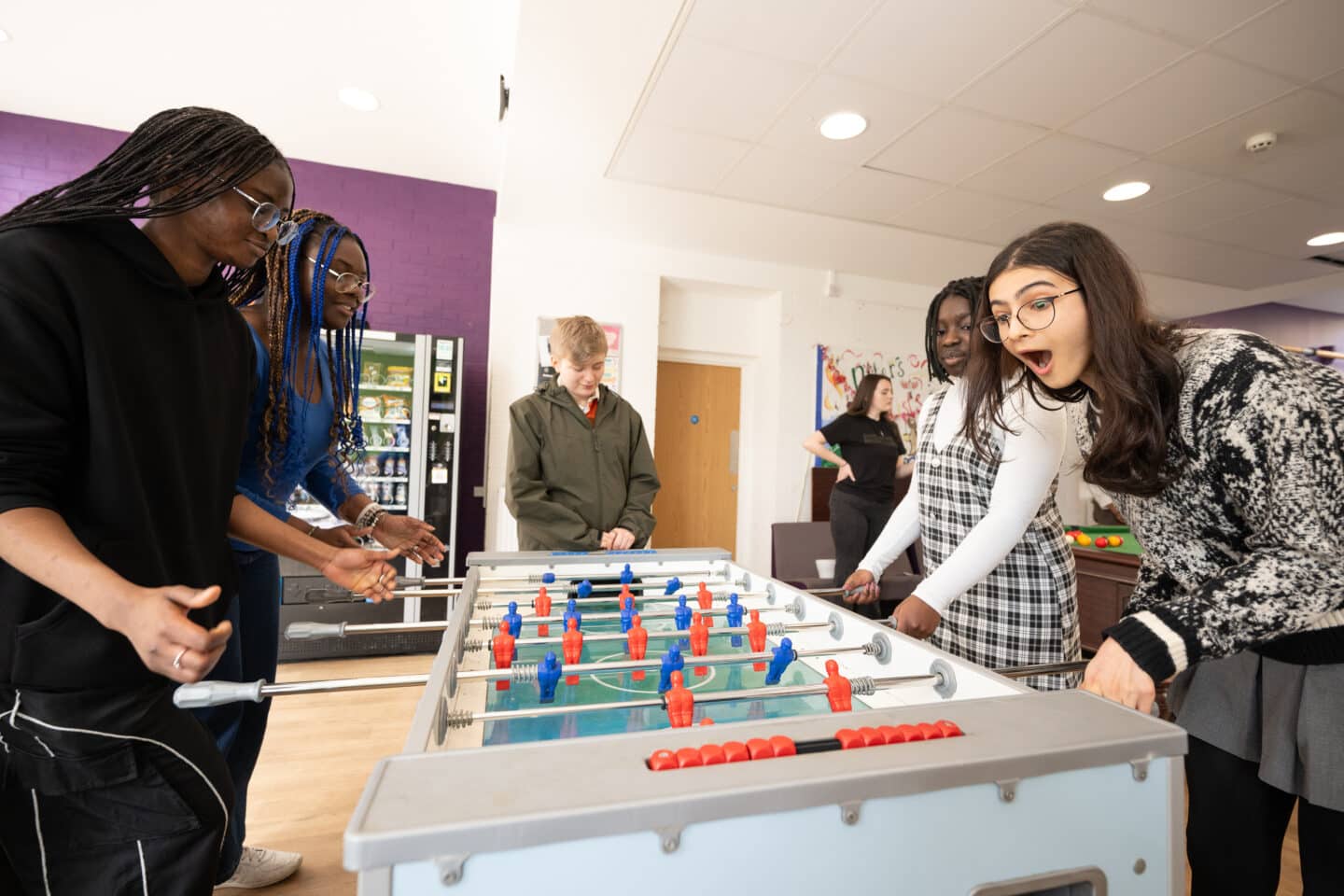Group of students playing table football