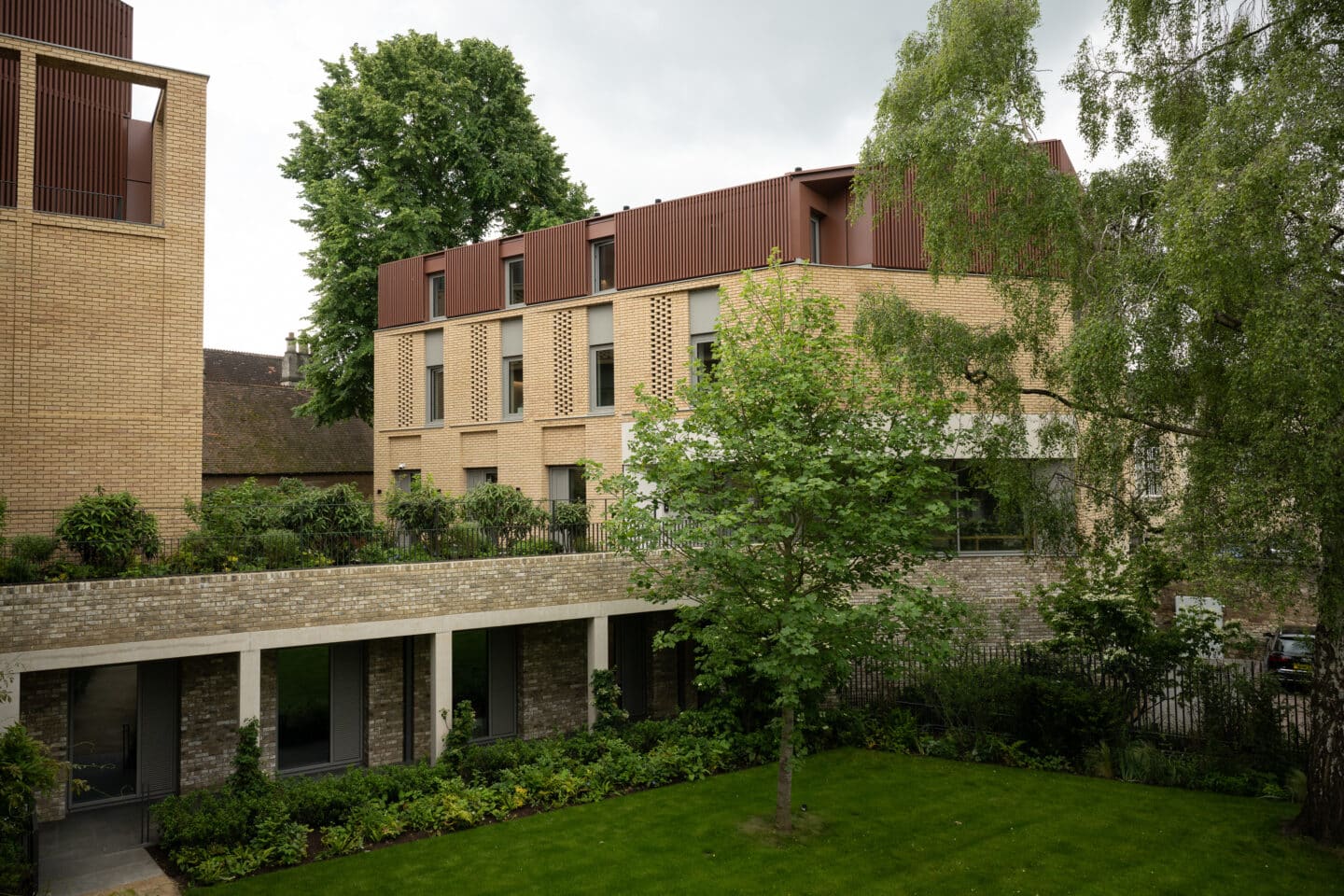 A brick building over a sunken garden
