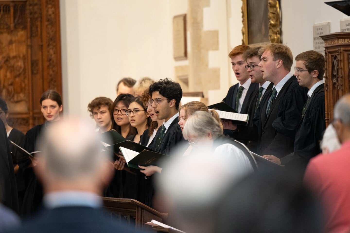 A choir singing in a chapel