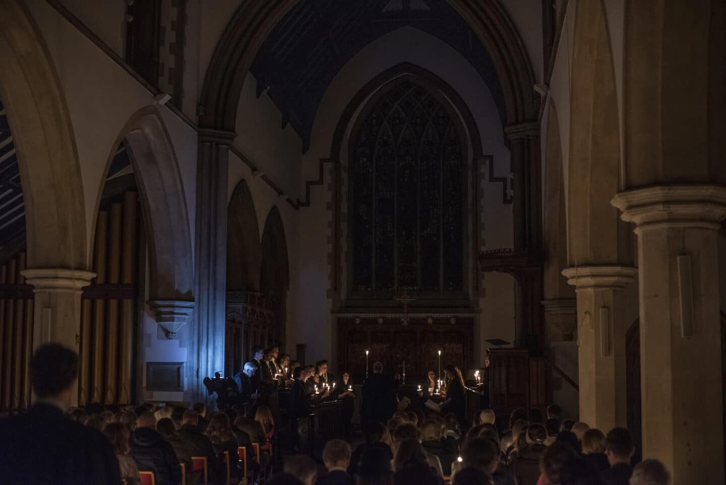 a choir singing by candlelight