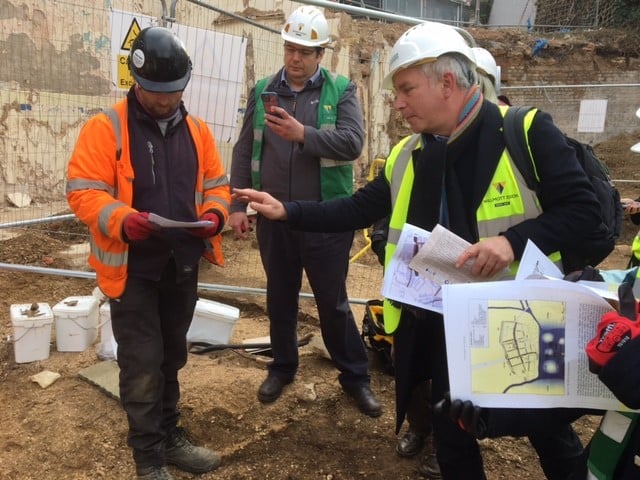 Professor Stephen Baxter and Professor Timothy Clack speaking with an archaeologist