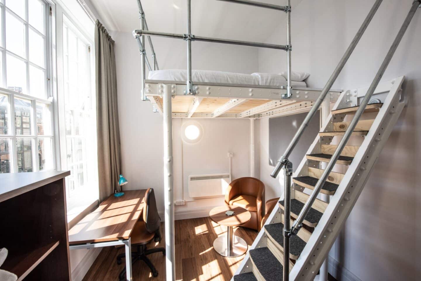 Study bedroom with desk, chair and table and platform bed