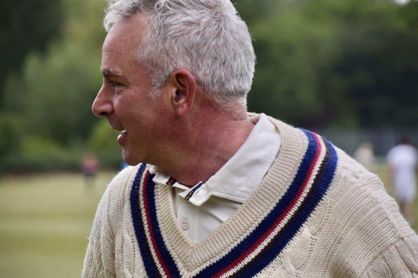 A man wearing a cricket jumper
