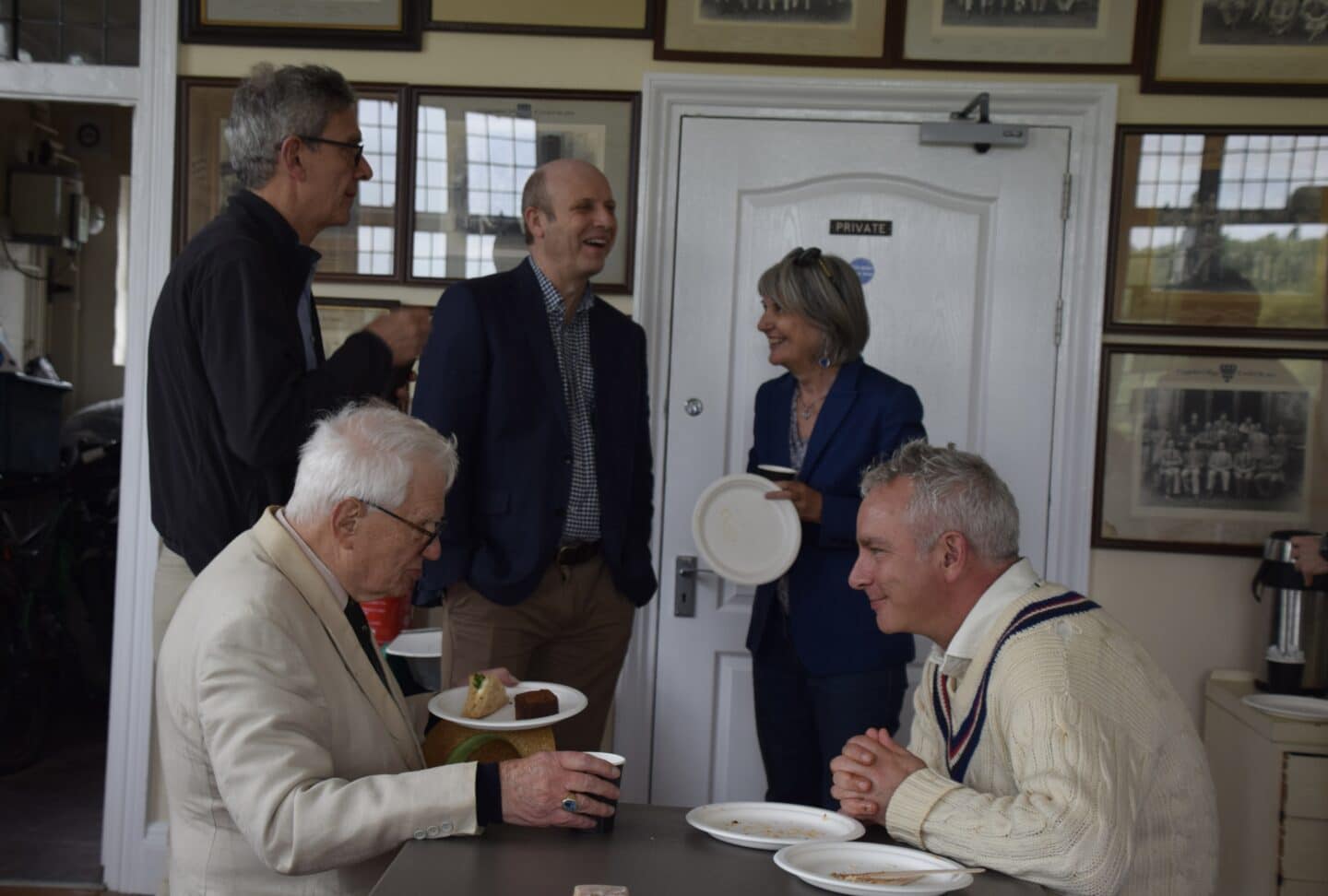 Two men sat at a table and chatting