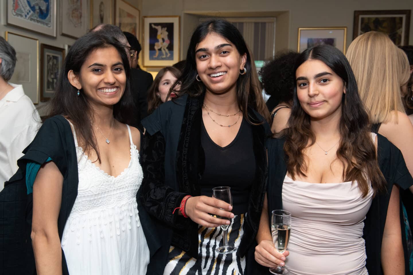 three people at a formal event