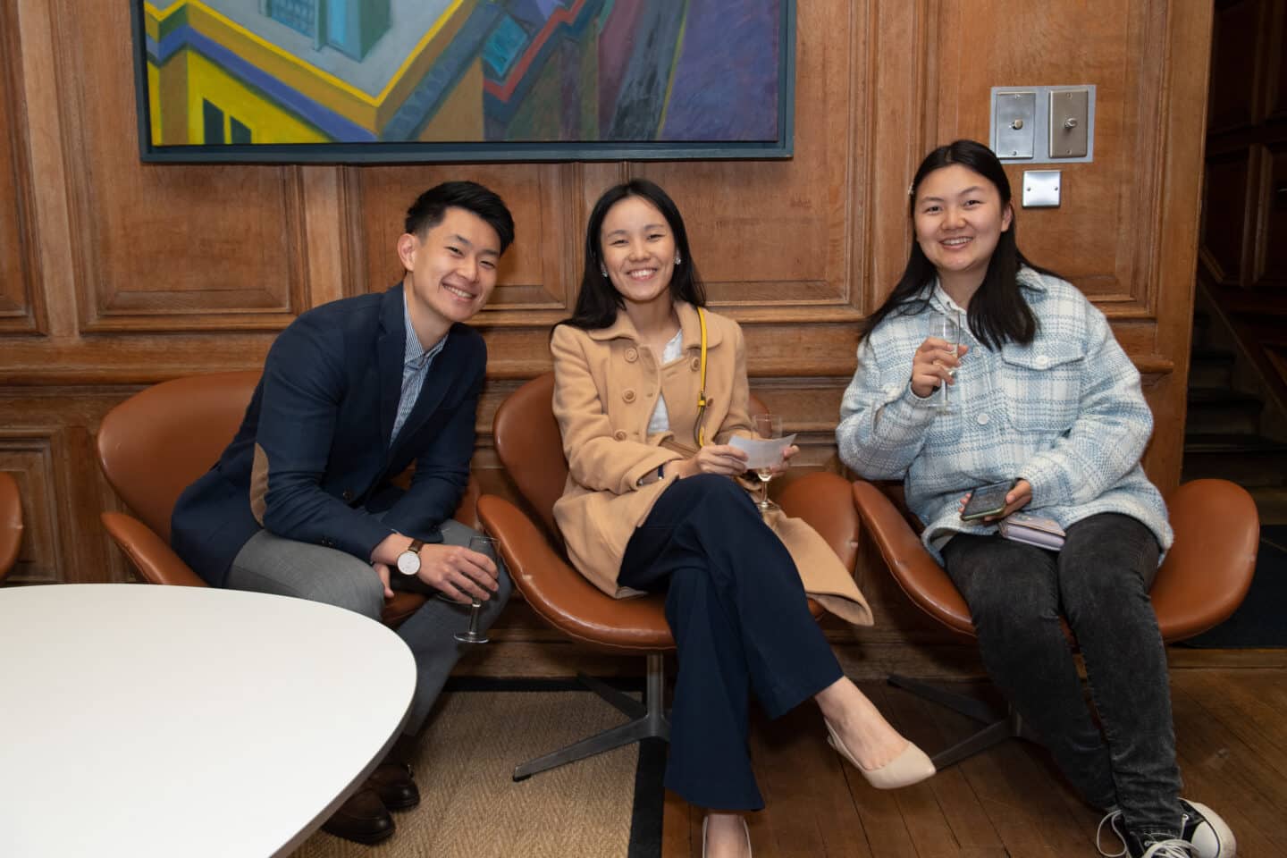 three people at a formal event