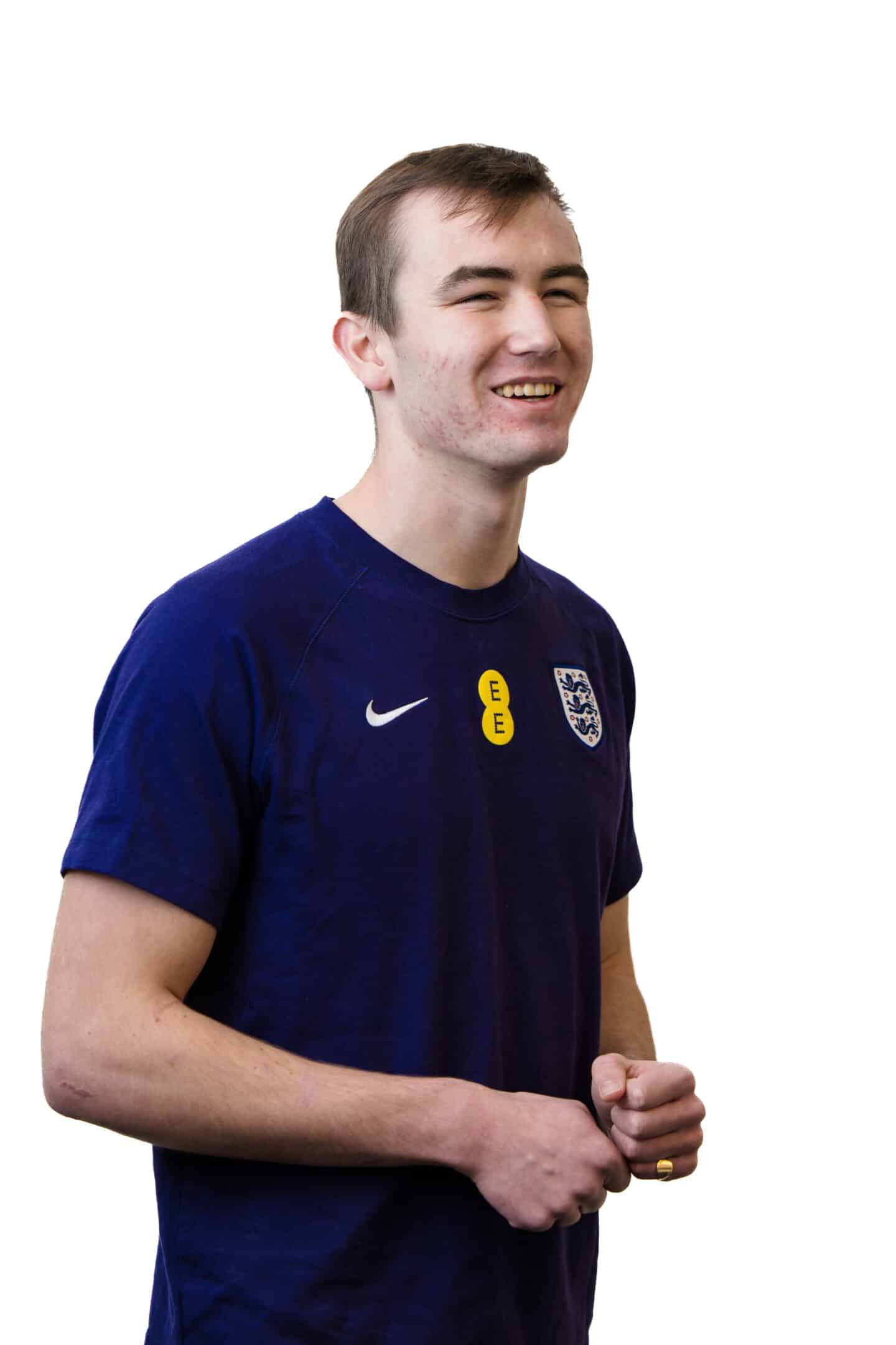 A young smiling person wearing an English football jersey