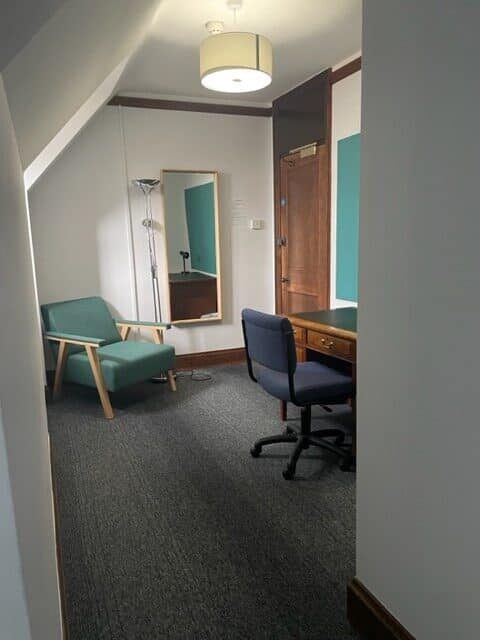 Study room with desk and chair and easy chair