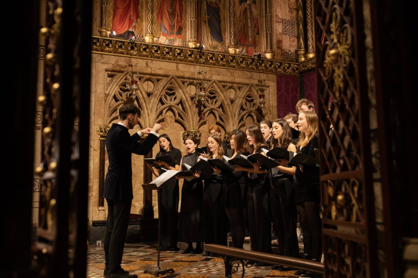 A choir singing in an ornate church