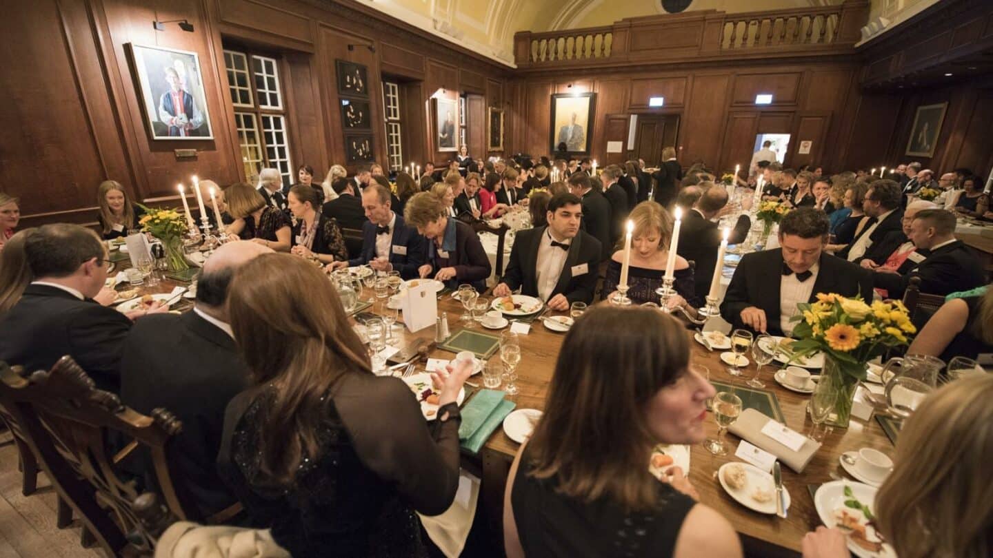 A formal dinner in a large dining hall