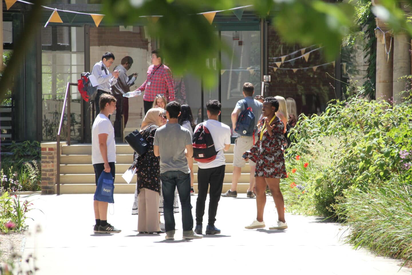 a group of people visiting a college