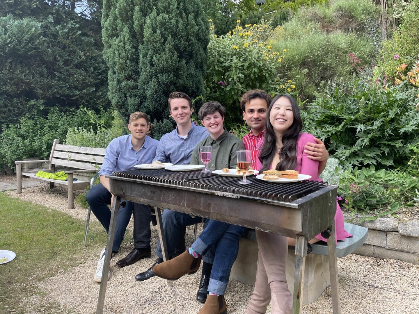 A group of people having a luncheon in a garden