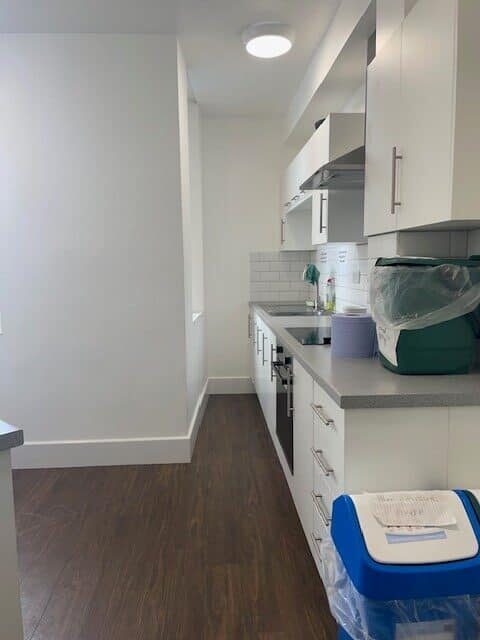 Kitchen with hob, sink and work surface