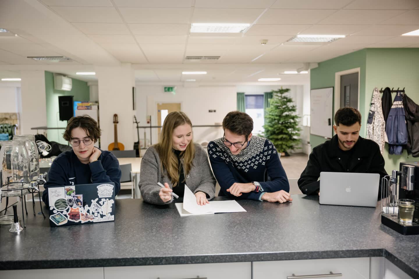 A group of people sat at a counter