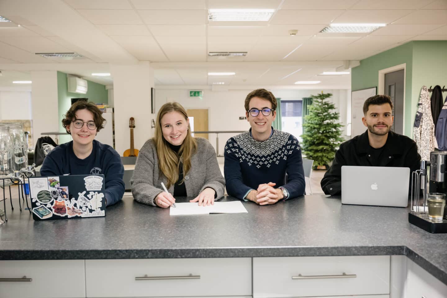 A group of people sat at a counter