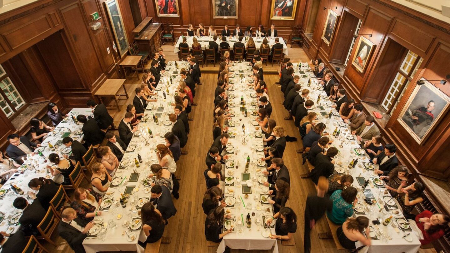 A formal dinner with a large group of graduate students in an Oxford dining hall