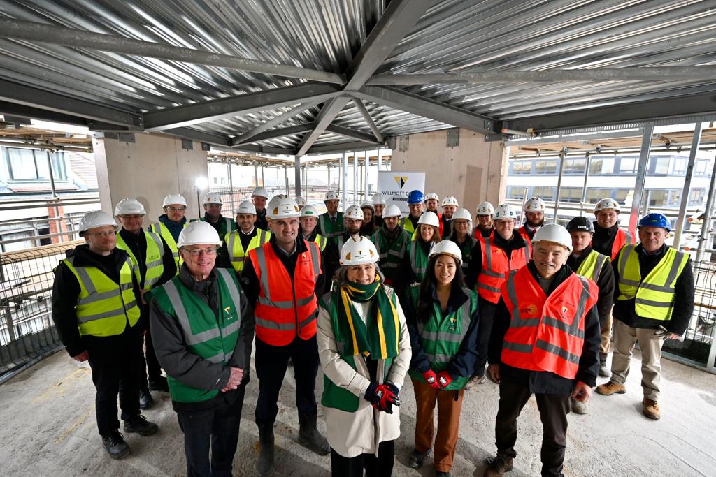 St Peter’s College and contractors Willmott Dixon marked the moment when construction work at the Castle Bailey Quad development reached its highest point.