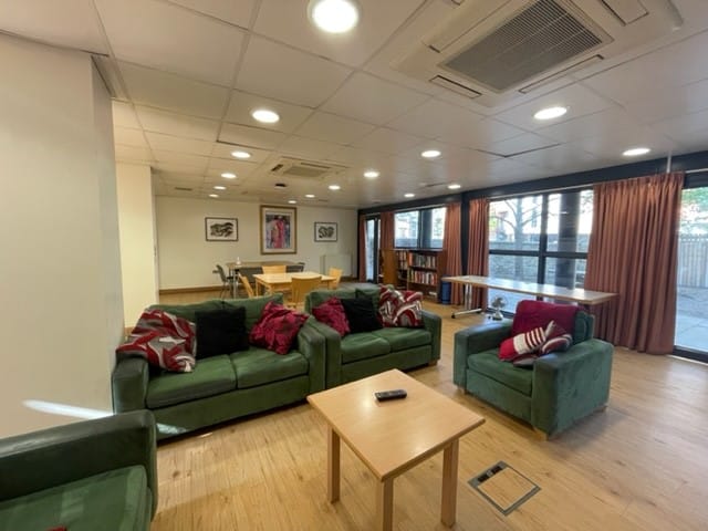 Common room with sofas and tables and chairs