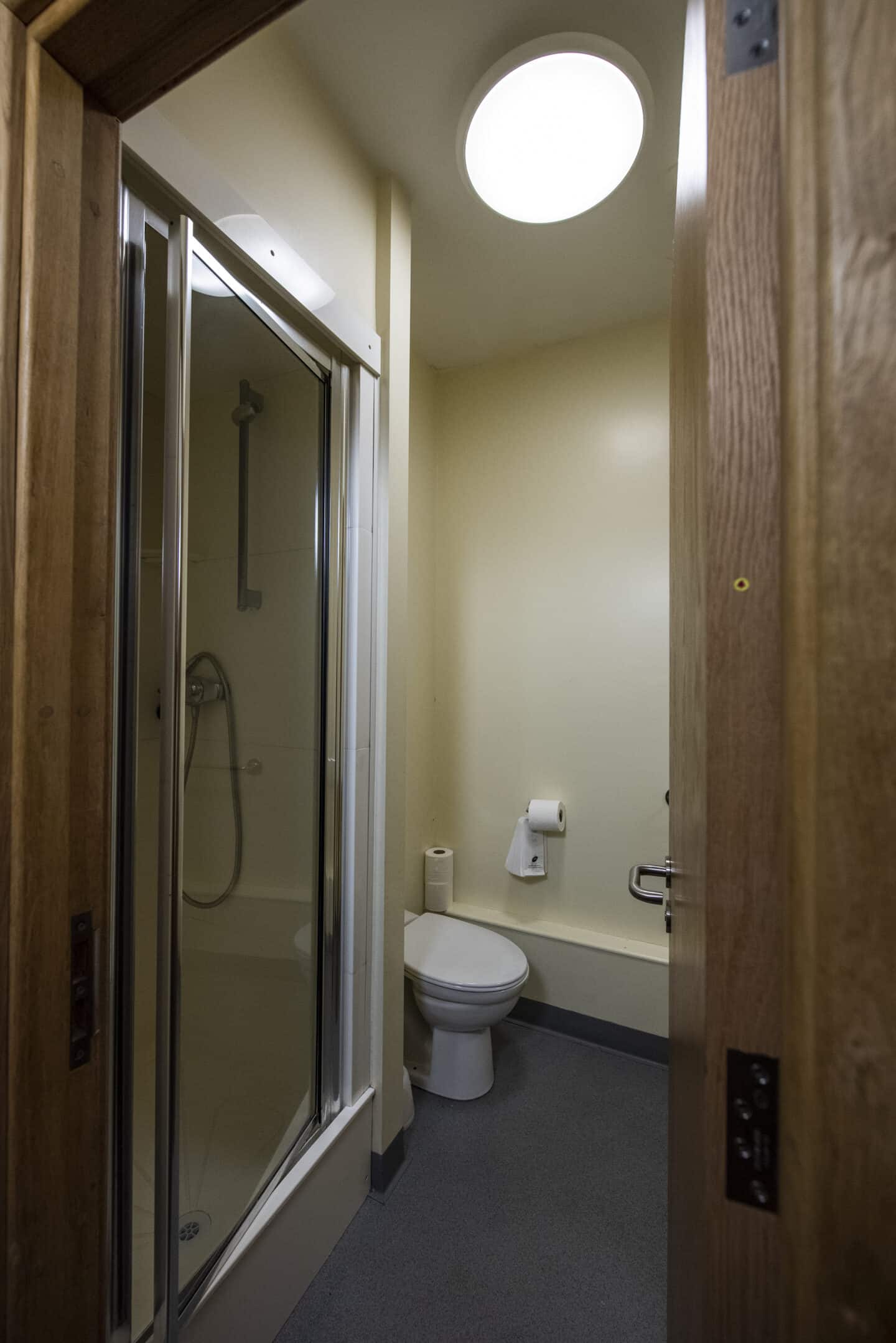 Bathroom with a shower cubicle and toilet