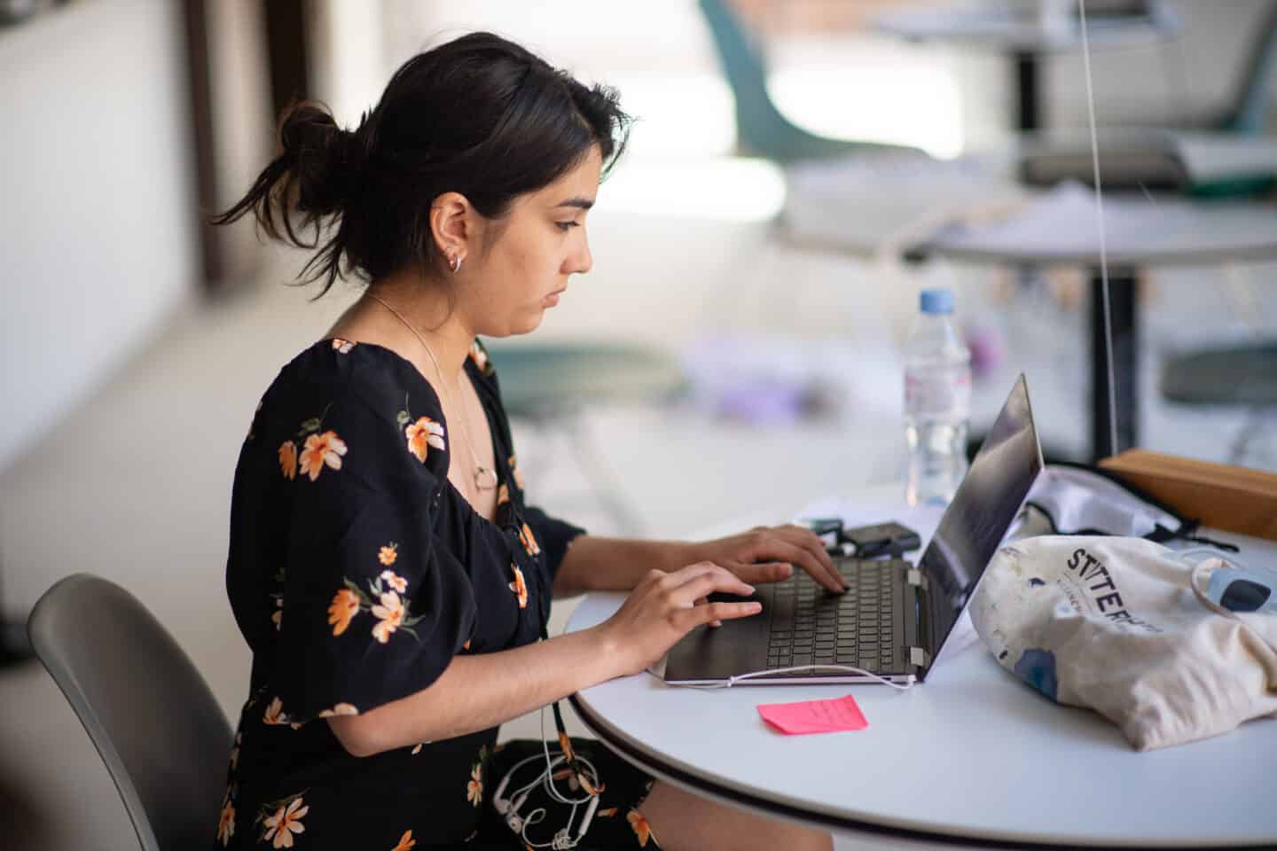 a woman working on a laptop