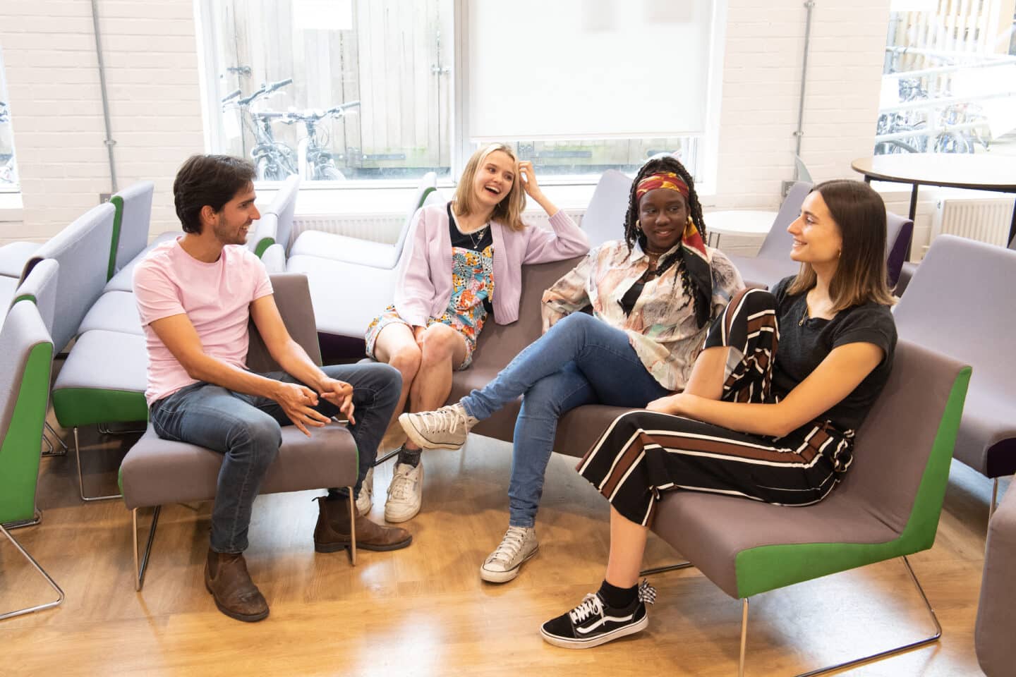 A group of people sitting and chatting