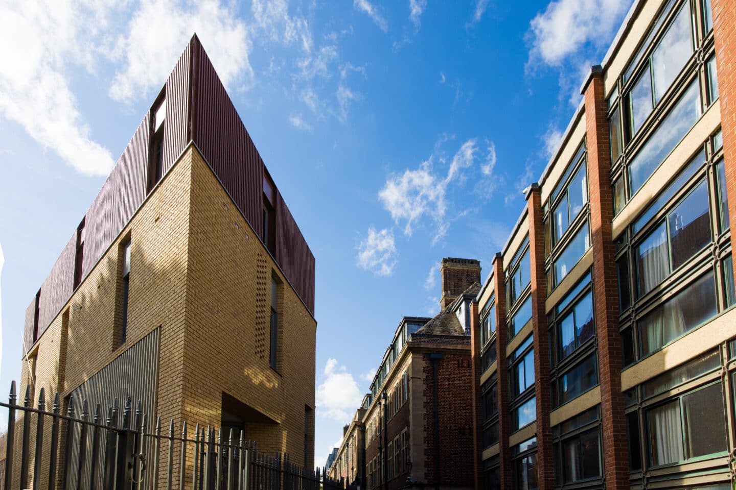 Two modern buildings with a blue sky