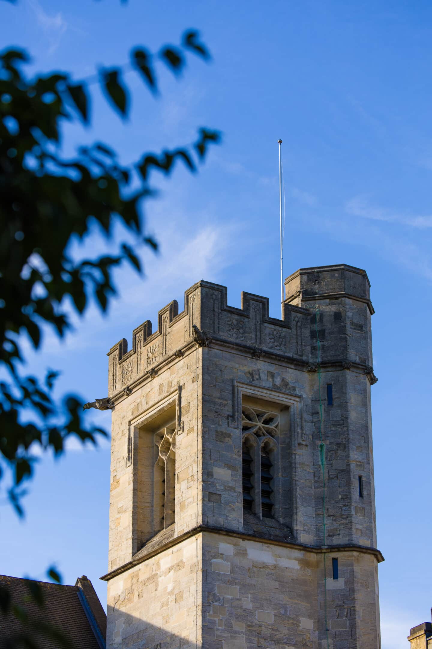 A Chapel tower against a blue sky.