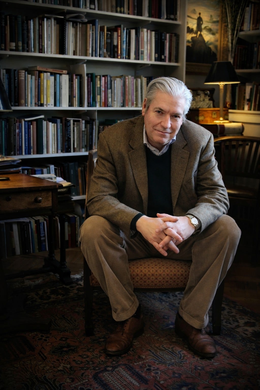 A man seated in an office