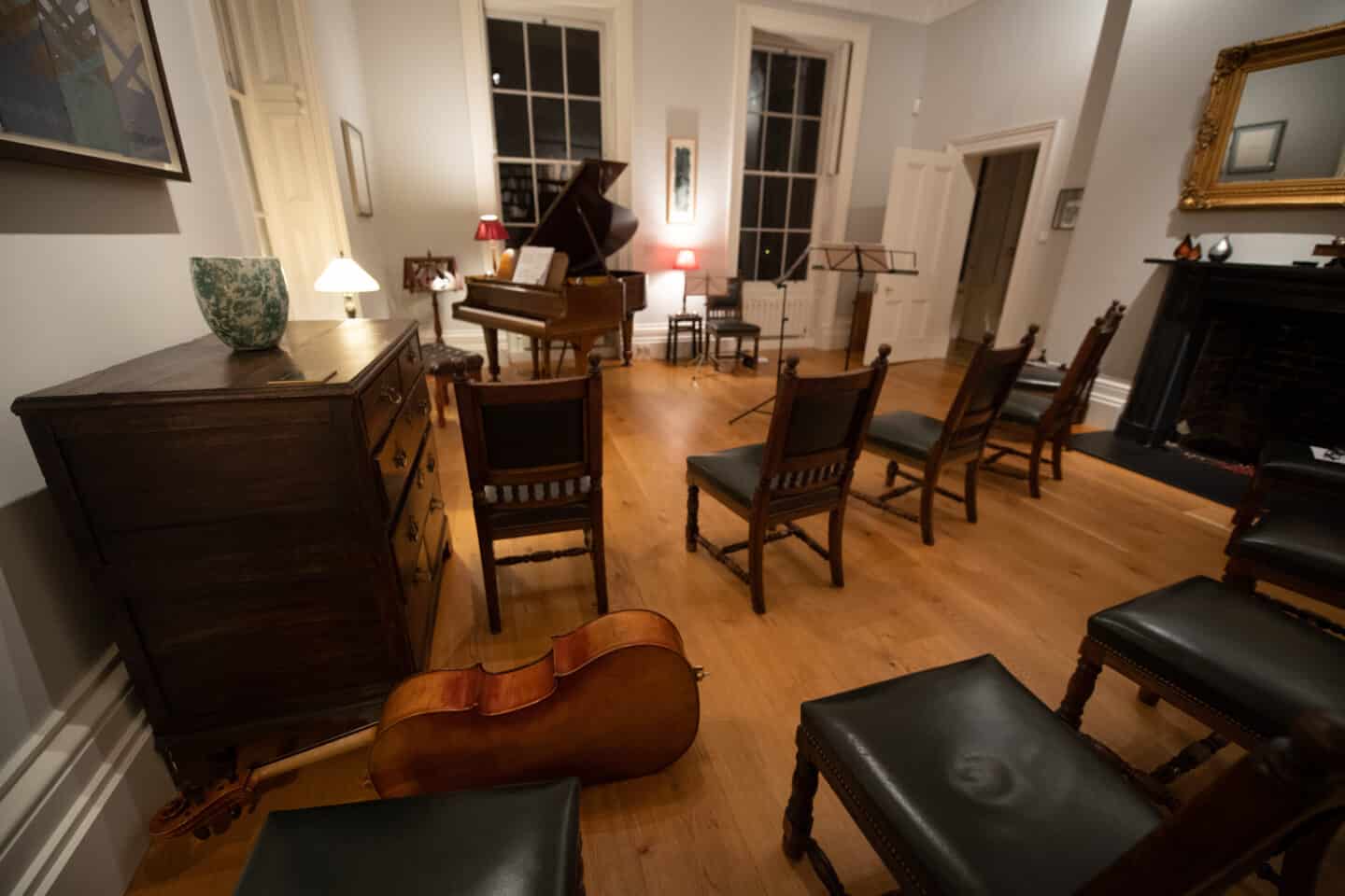 A small room set up for a musical recital.