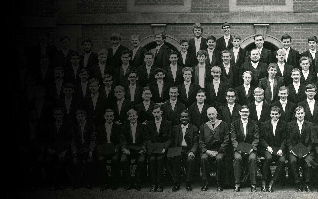 Decorative image showing an archival image of students in gowns