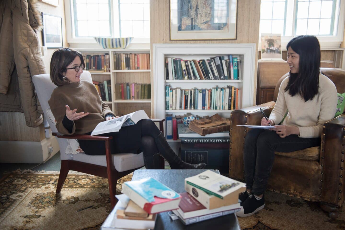 two people having a meeting in an office