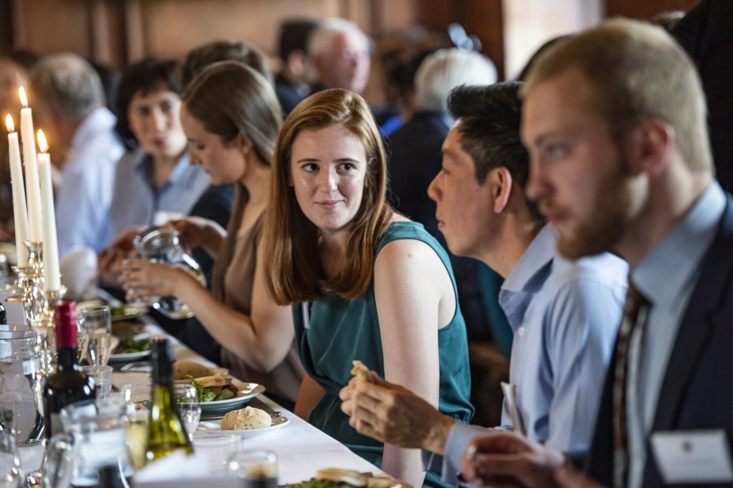 a group of people enjoying a formal meal