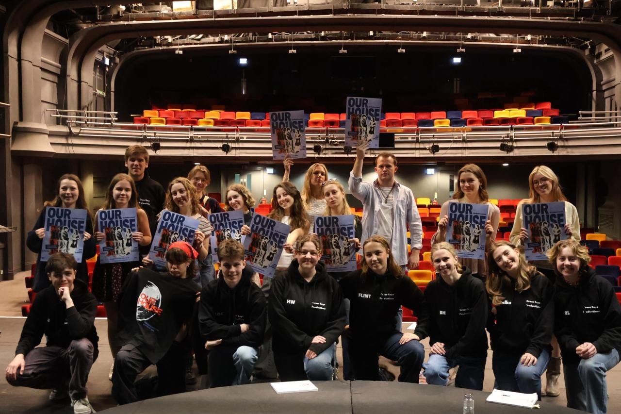 A group of young people in a theatre