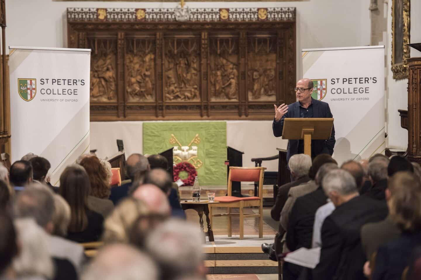 a man standing at a lectern giving a speech