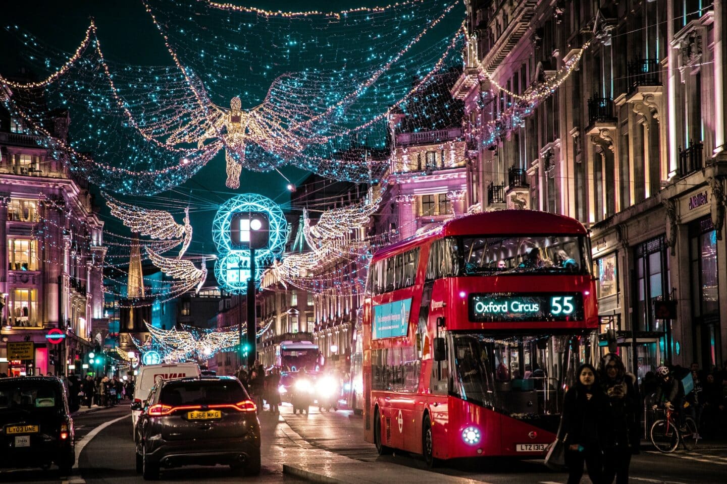 London scene with Christmas lights and a large red bus